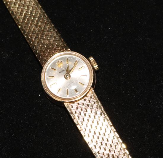 A ladys 9ct gold Rolex Precision manual wind wrist watch on a 9ct gold Rolex bracelet,